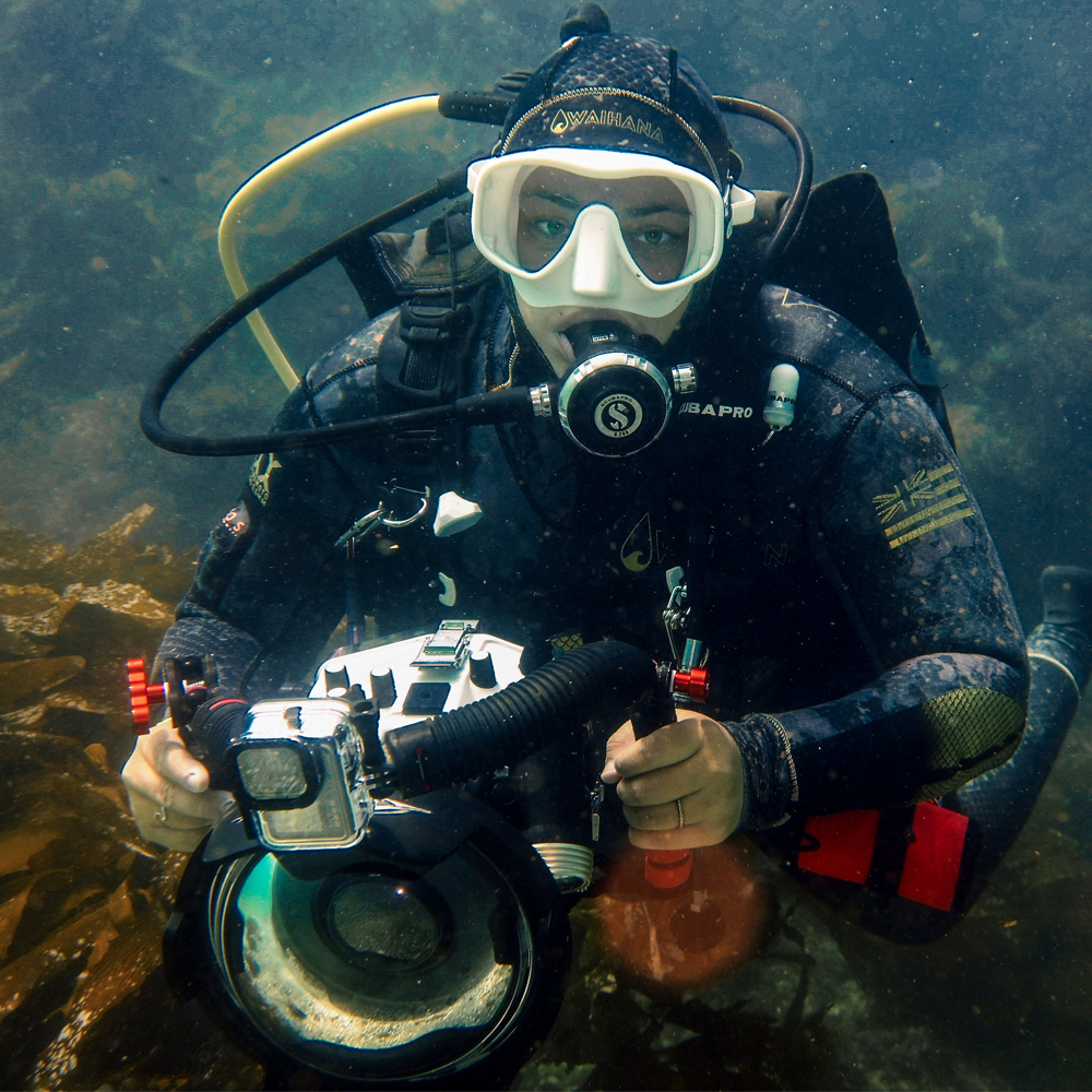 Ren Taylor scuba diving with her underwater photography equipment